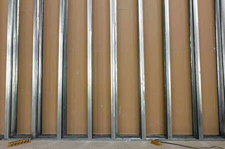 Metal Framing services in Melbourne and Brevard County Florida.  Metal wall studs with drywall attached on one side.